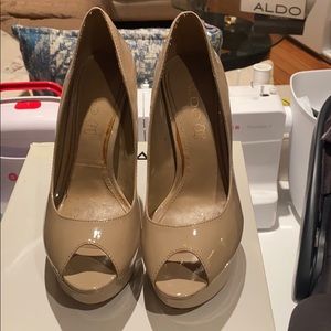 Nude patent leather peep-toe heels